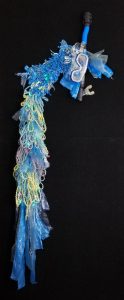 Crocheted wall piece with handspun yarn, plastic, snorkel and beads