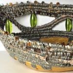 Hand coiled basket with paper clay base, pressed clematis and glass beads.