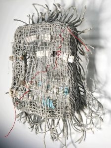 Weaving of handspun yarn, cotton thread and salvaged maps,
